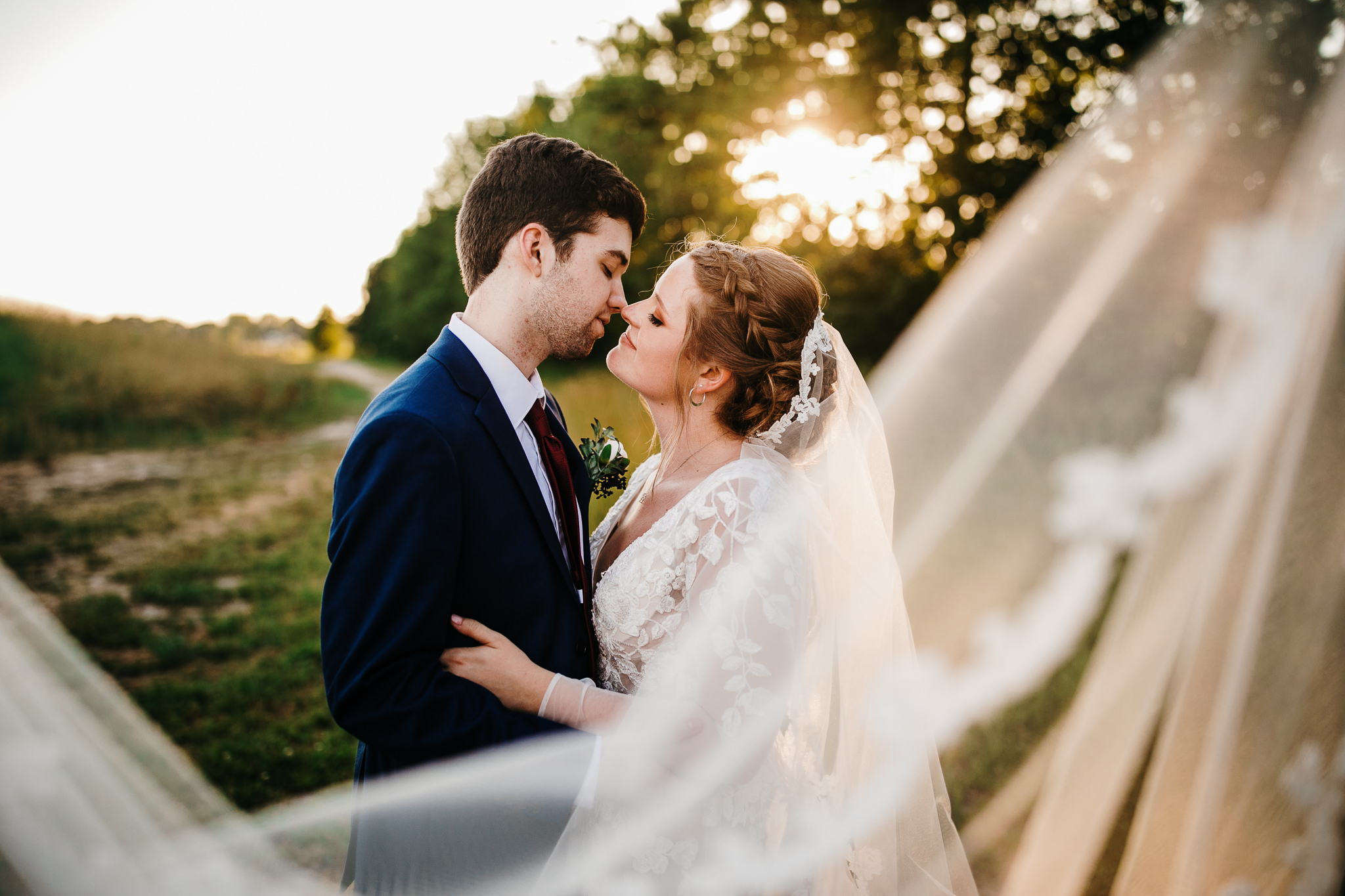 Romantic sunset bride and groom photo